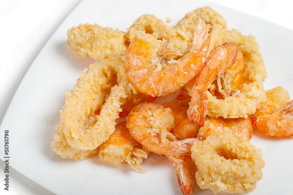 plate of fried fish on white background plate of fried fish on white background