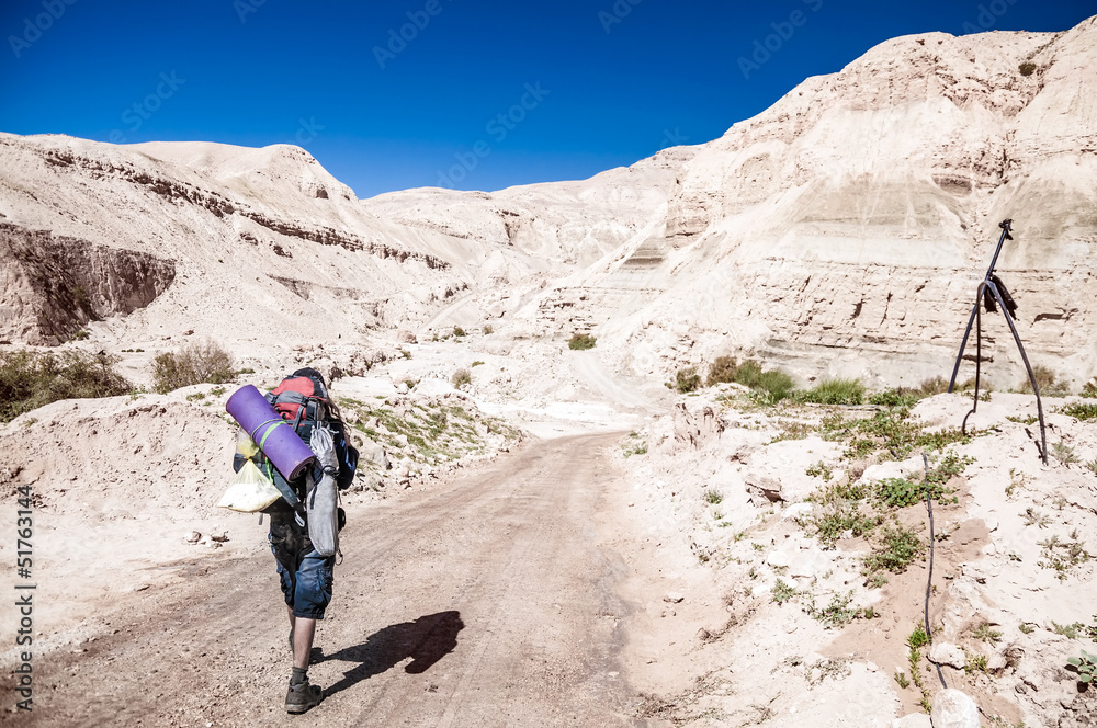 Man is hiking in Wadi Hasa, Jordan