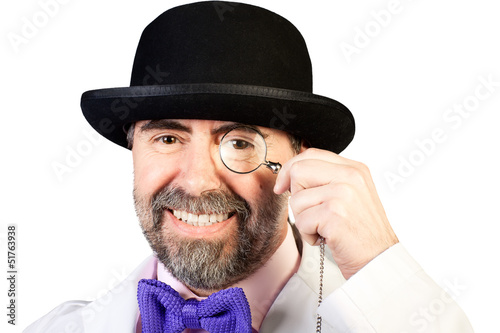Portrait of happy middle-aged man in a hat with a monocle in his photo