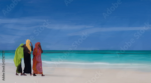 women on the beach in zanzibar