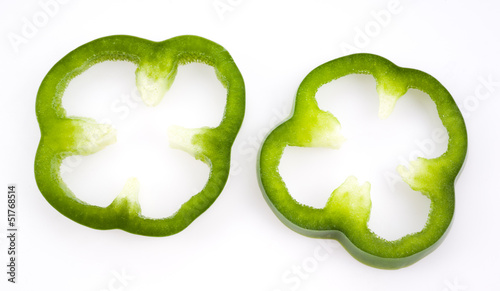 Slika na platnu Sliced green pepper isolated on white