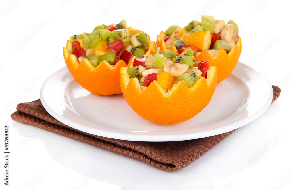 Fruit salad in hollowed-out orange isolated on white Fruit salad in hollowed-out orange isolated on white