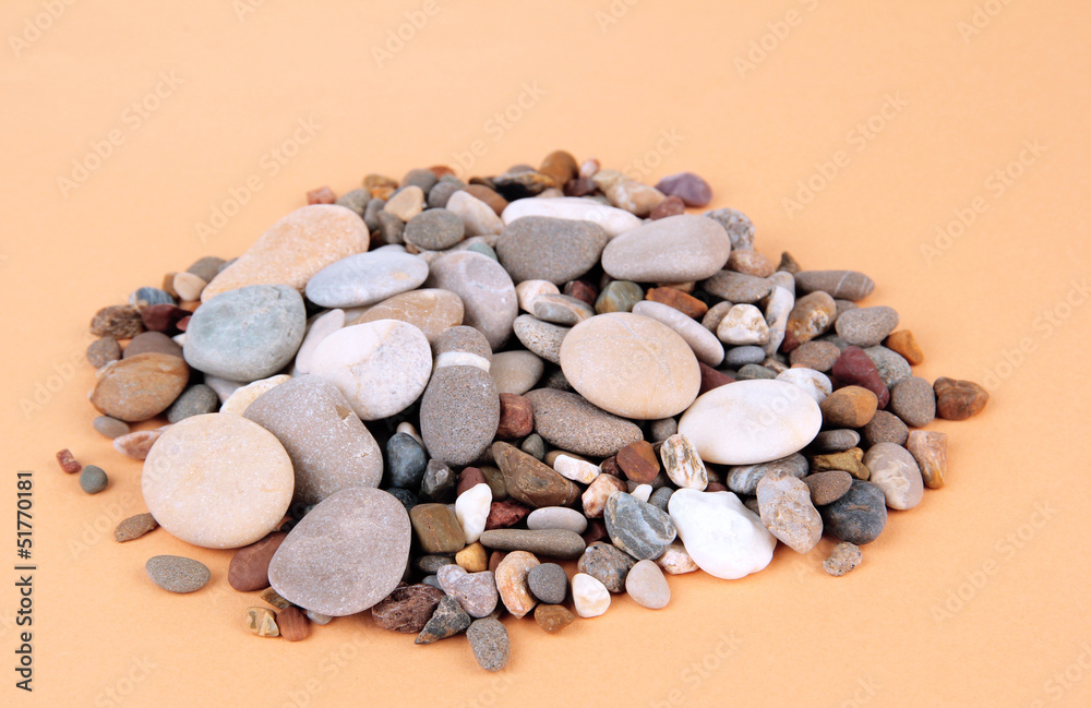 Sea stones on color background