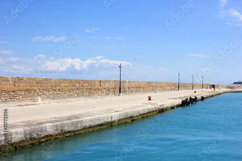 stone wall of a port © smoxx