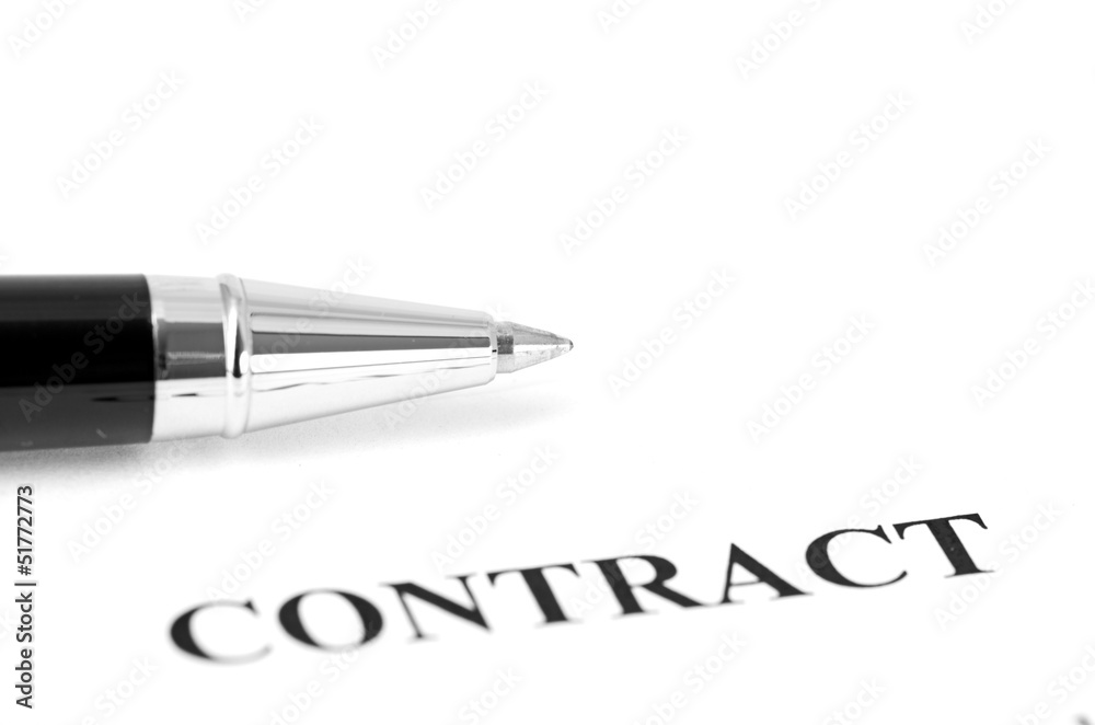 Close-up of silver pen on contract. Close-up of silver pen on contract.