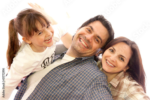 Famiglia, papà e mamma che giocano con la figlia photo