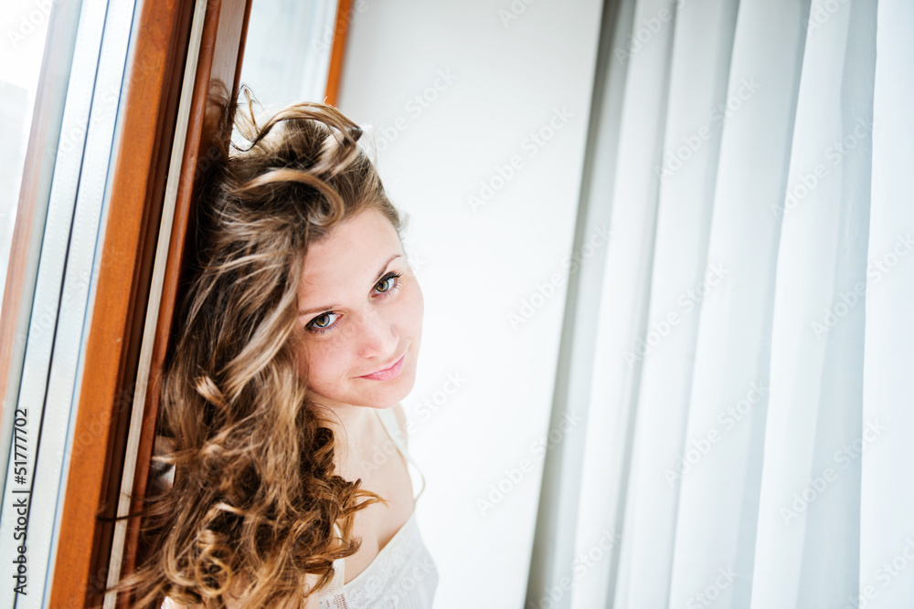 Portrait of beautiful young happy smiling woman with long curly Portrait of beautiful young happy smiling woman with long curly