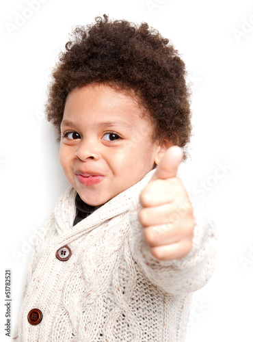 Cute child doing thumbs up sign