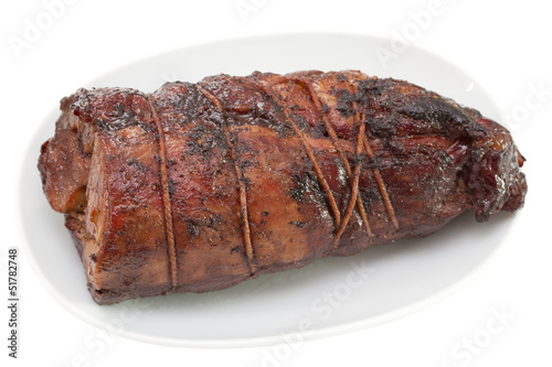 meat on white dish on white background
