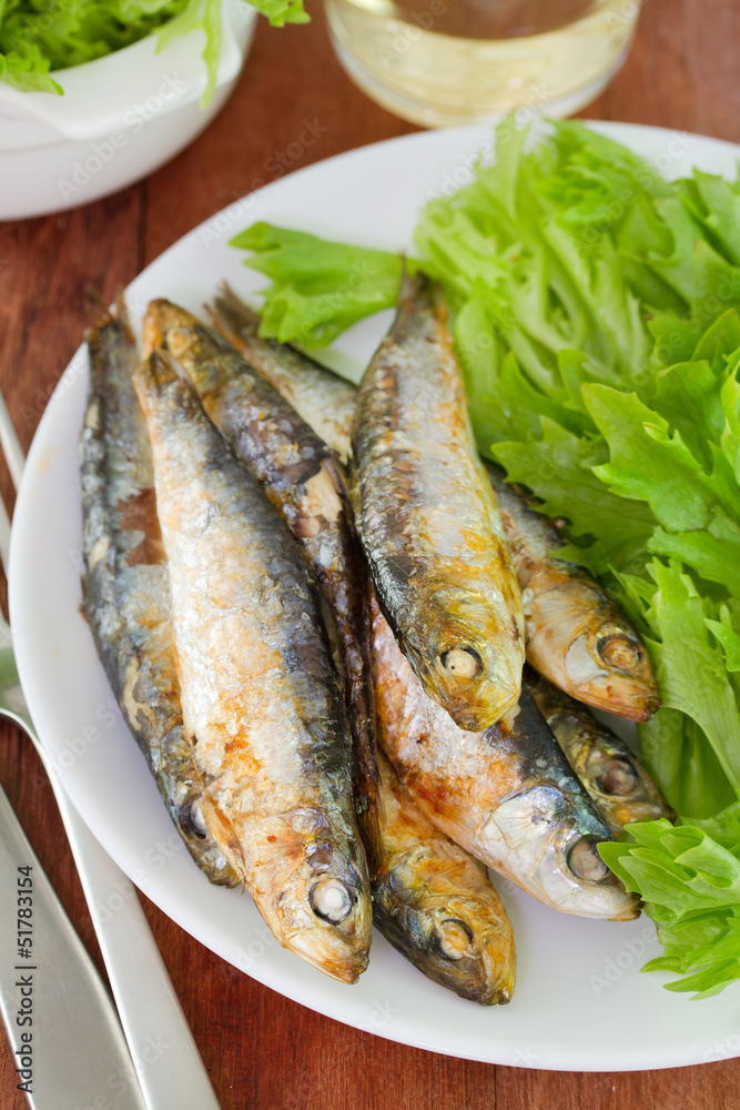 sardine with salad and glass of wine sardine with salad and glass of wine