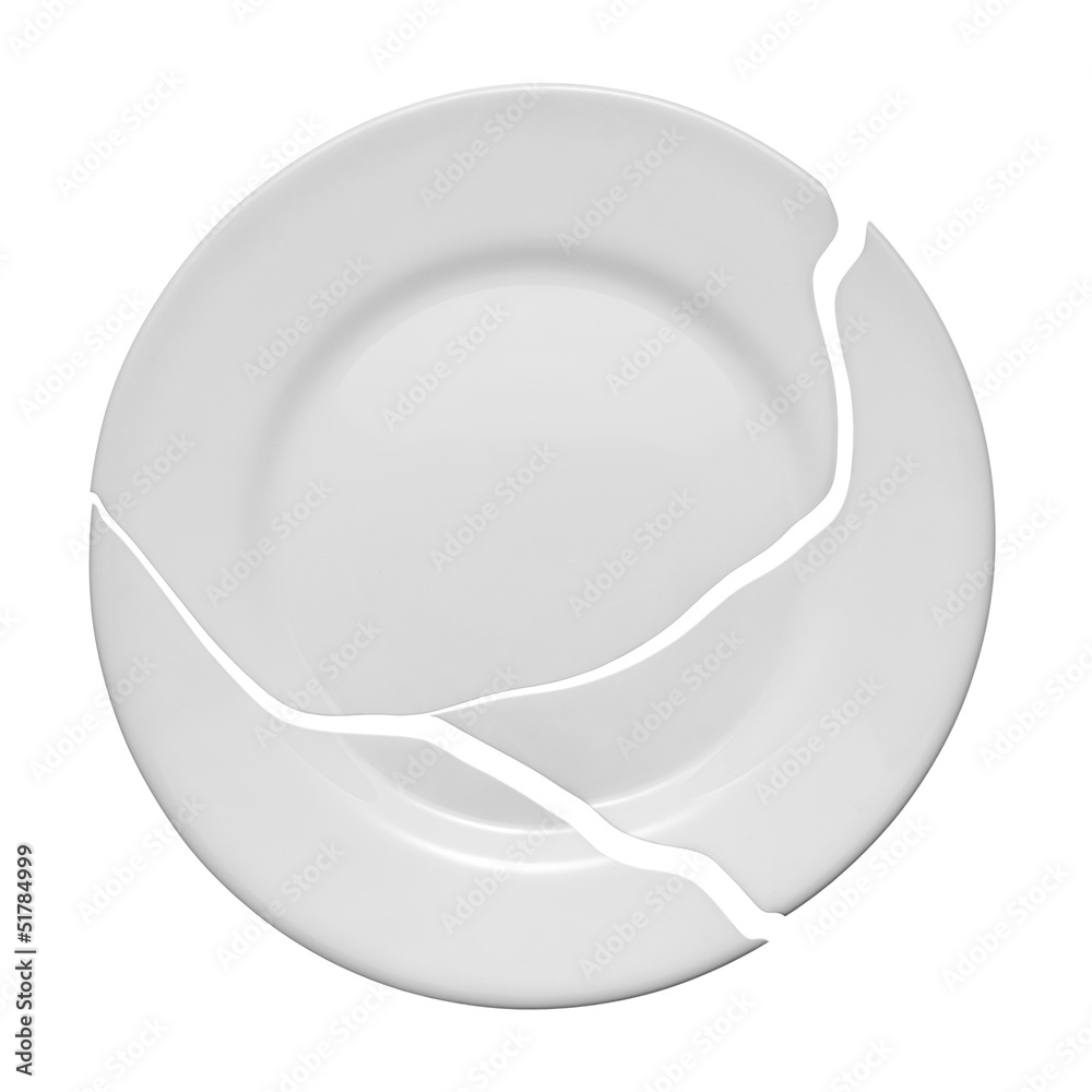 Broken plate on a white background. Metaphor of a family quarrel Broken plate on a white background. Metaphor of a family quarrel