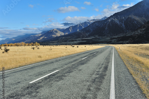Straight empty highway leading into Aoraki-Mount Cook