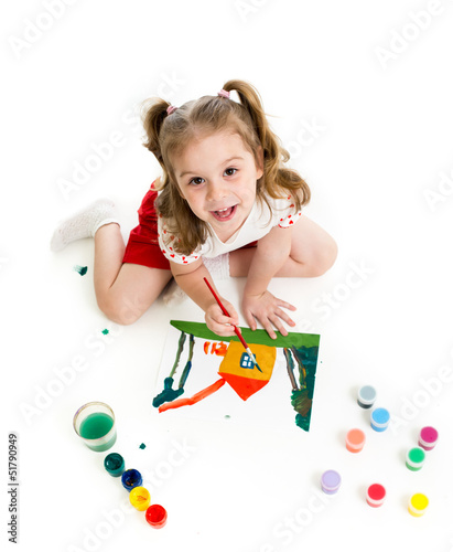 Kid girl is painting. Top v...