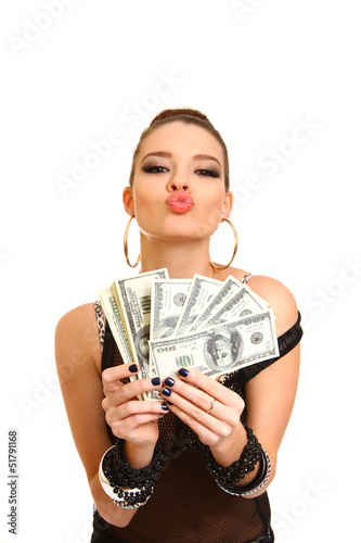 Sexy brunette girl holding dollars on a white background