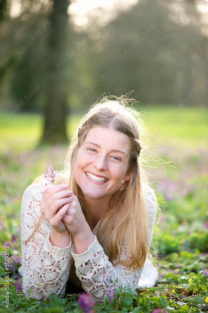 Beautiful young blond woman lying on the meadow Beautiful young blond woman lying on the meadow
