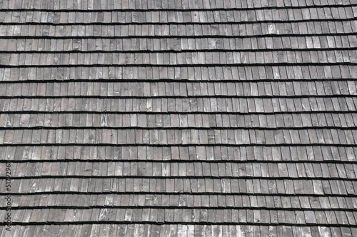 Wooden shingles on the roof, background