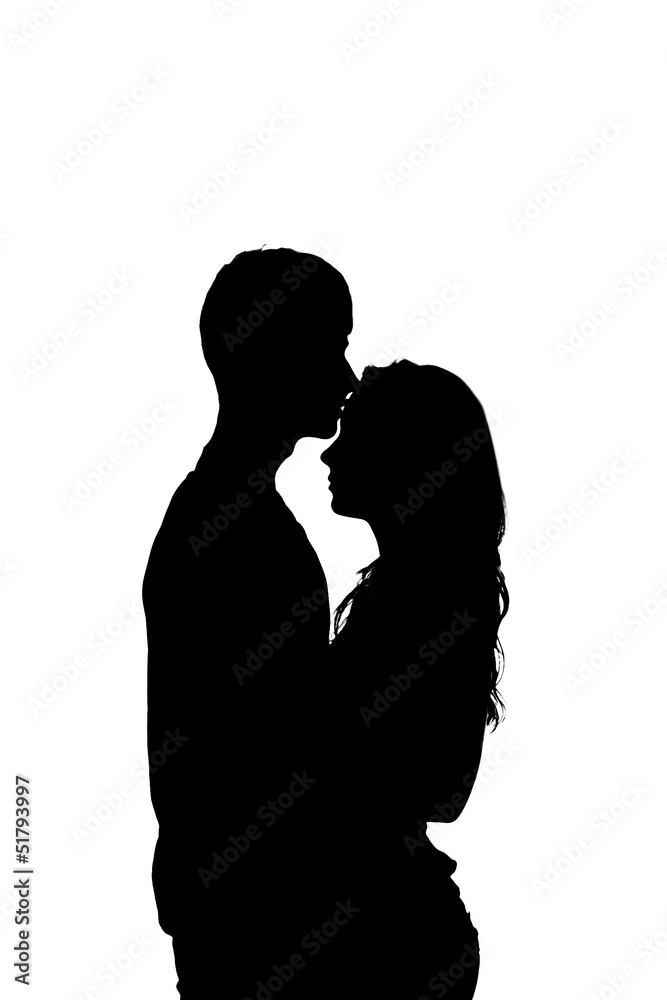 Silhouette of a young couple in love.