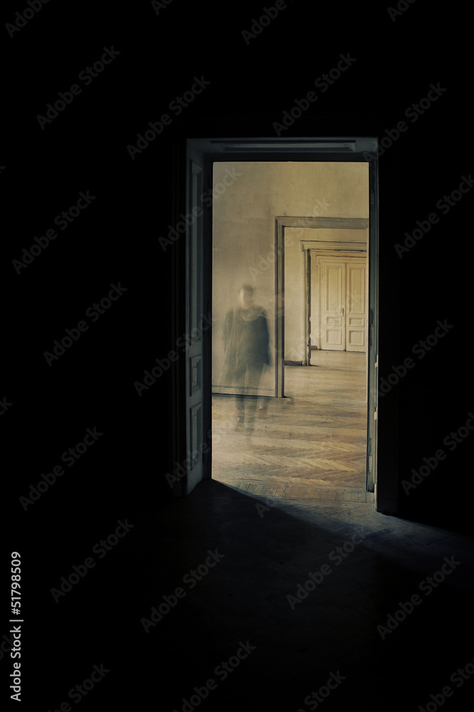 Silhouette in a corridor approaching, closed door behind