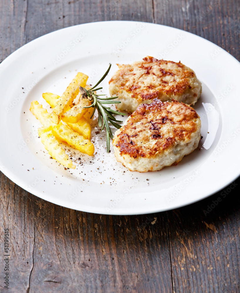 Fishcakes with french fries and herbs Fishcakes with french fries and herbs