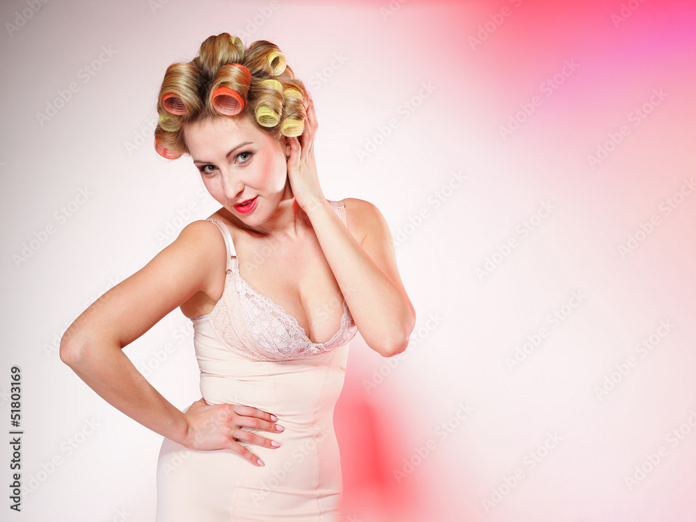 sexy woman in underwear curlers in hair