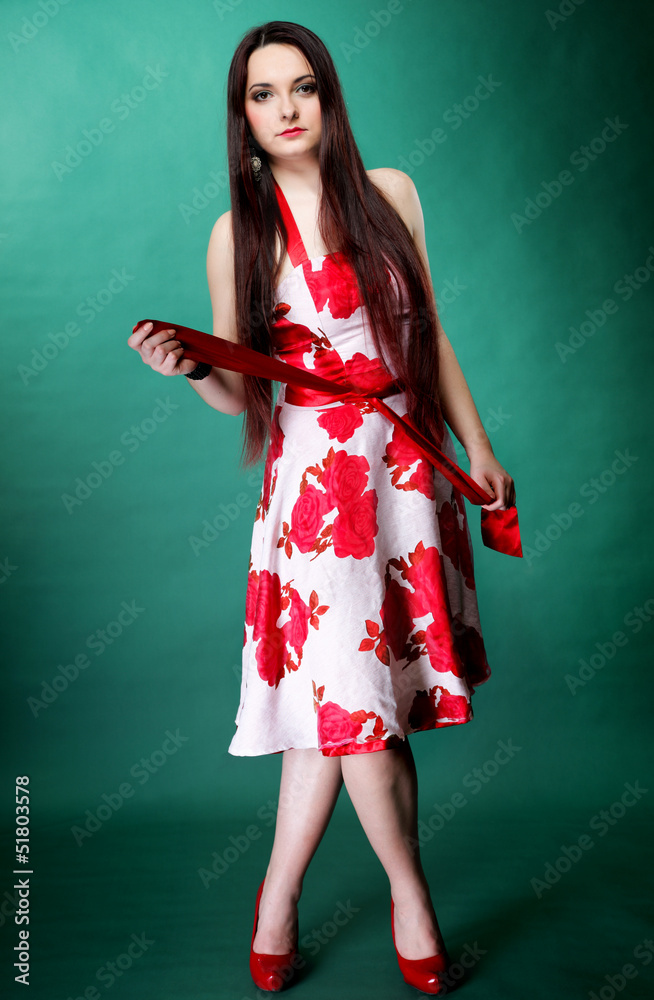 young woman in summer flowery dress on green young woman in summer flowery dress on green