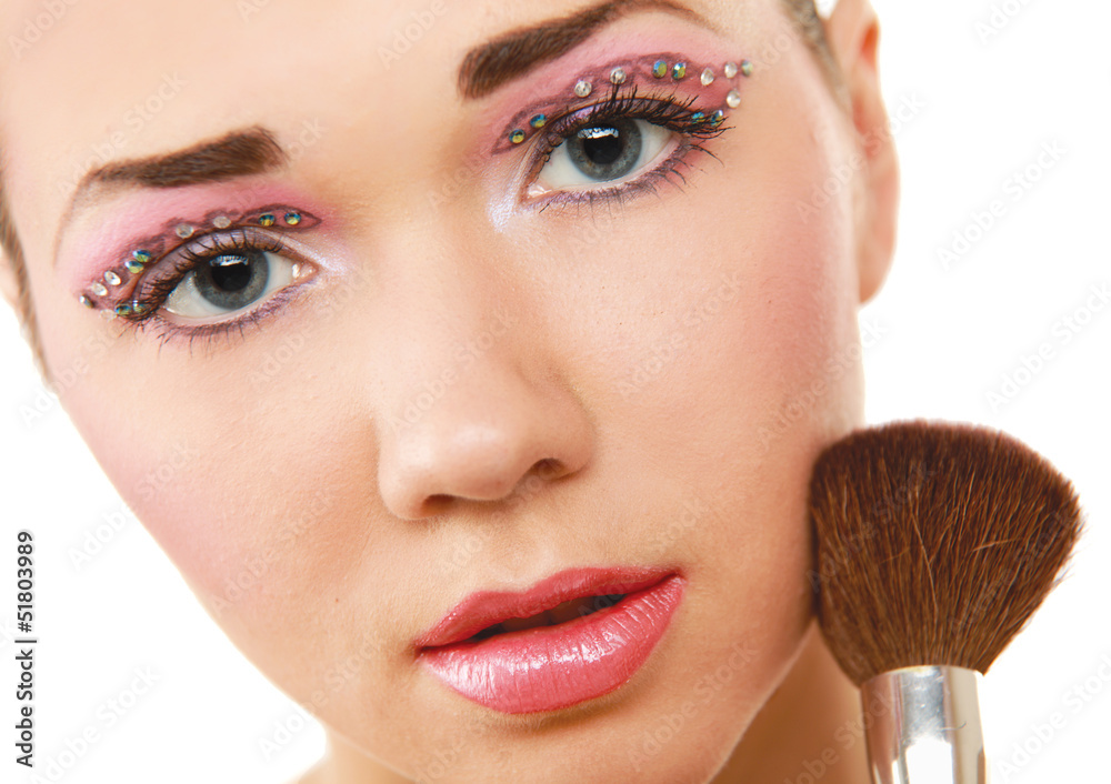 Beautiful young adult woman holds the make-up Beautiful young adult woman holds the make-up
