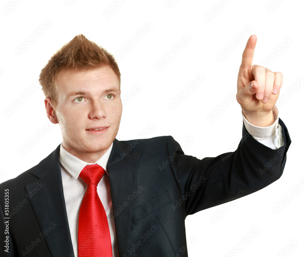 A young man pointing something isolated on white background