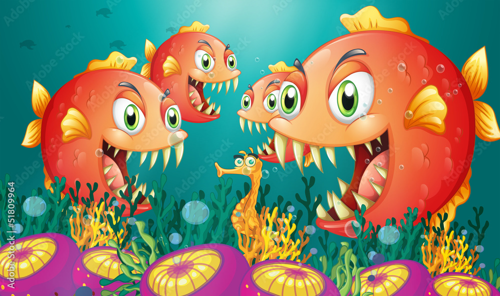 Fototapeta premium A seahorse surrounded by a group of hungry piranhas