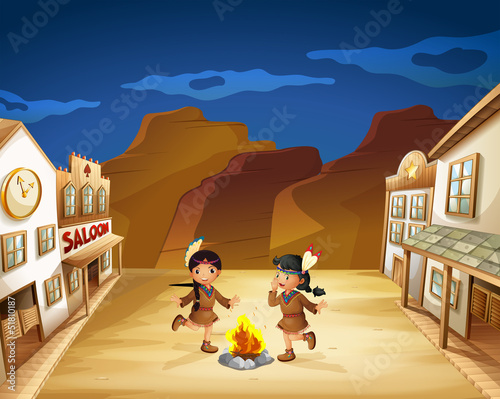 Two Indian girls dancing around the fire