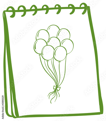 A green notebook with balloons at the cover page