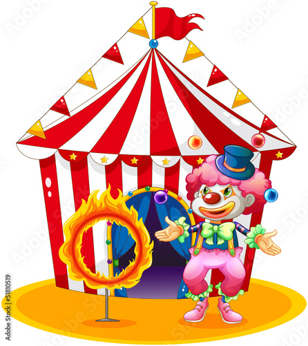 A female clown juggling in front of the tent