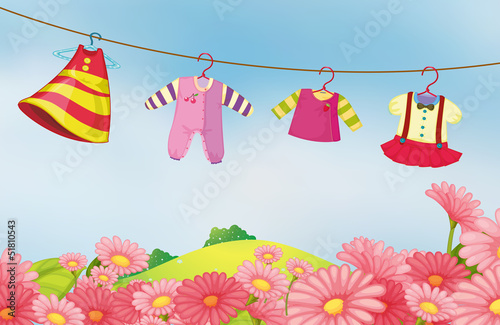 A garden with hanging clothes for the baby