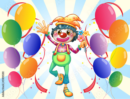 A clown in the middle of the balloons with flowers