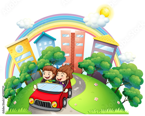 A girl and a boy riding at the car along the road