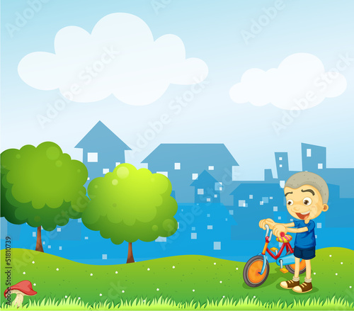 A boy holding a bike