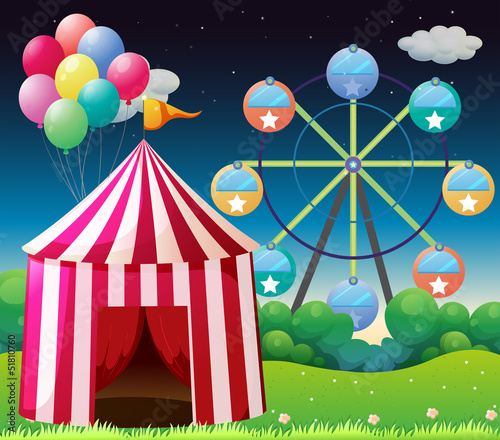 A red circus tent with balloons