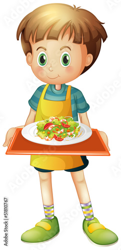 A young boy holding a tray with a plate