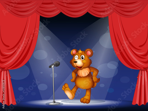 A stage with a bear performing