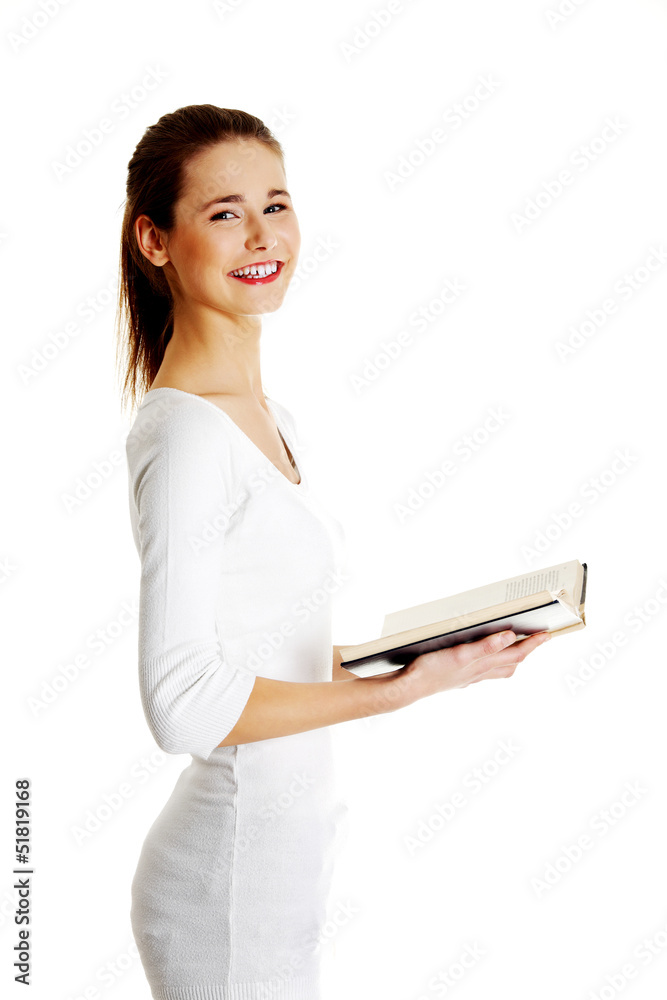 Teen woman reading book Teen woman reading book
