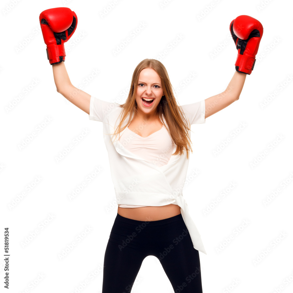 Woman celebrating with arms up wearing boxing gloves - isolated Woman celebrating with arms up wearing boxing gloves - isolated