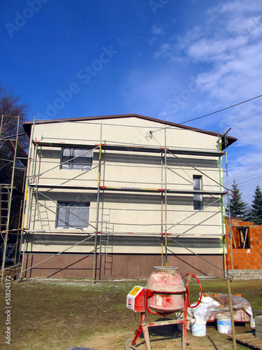 mixer for mortar and concrete and scaffolding repaired the walls