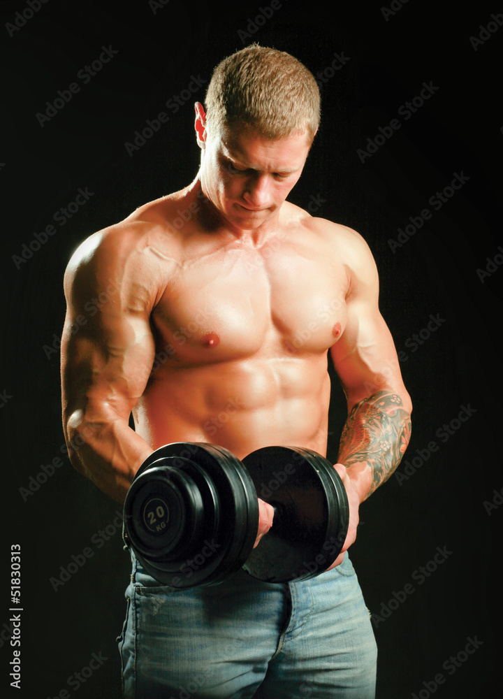 Handsome muscular man working out