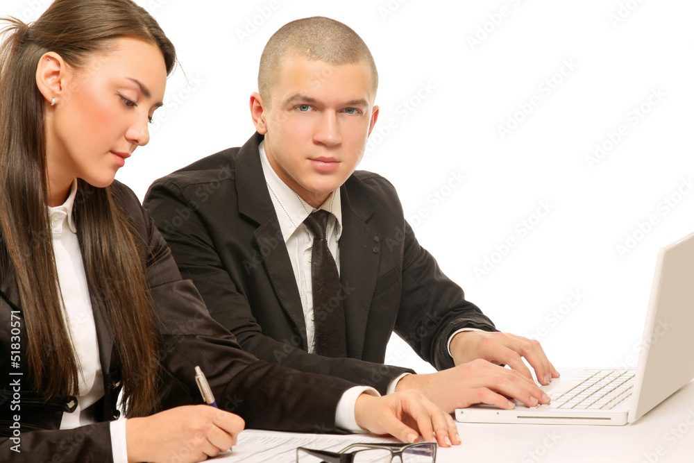 Businesspeople working at desk with a laptop, isolated on white