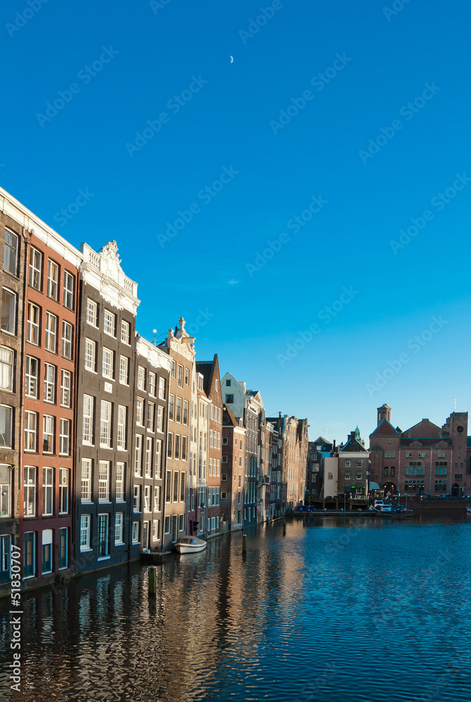 Amsterdam canals and typical houses with clear evening sky