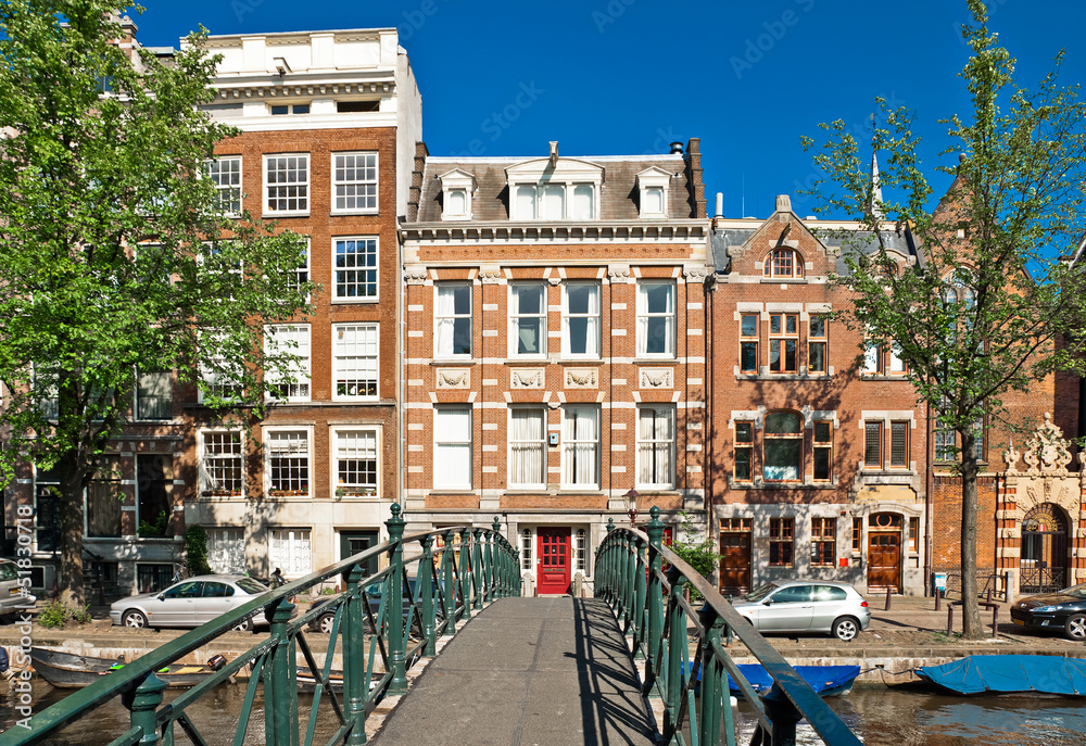 Amsterdam canal bridge and typical houses