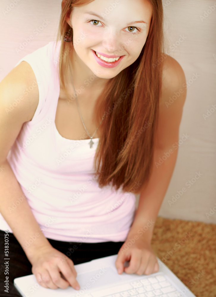 Portrait of young woman sitting on the floor Portrait of young woman sitting on the floor