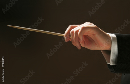 Fototapeta Naklejka Na Ścianę i Meble -  Concert conductor's hands with a baton