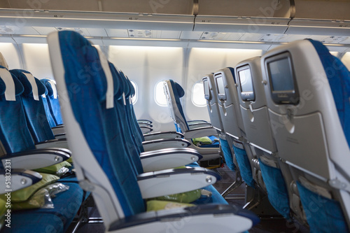 Interior of transcontinental aircraft with comfortable seats photo