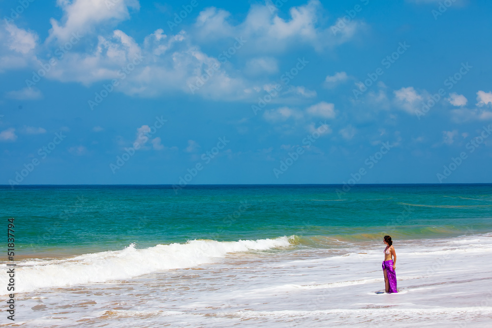 Woman takes rest at the sea shore