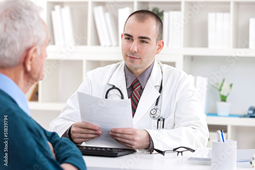 doctor talking with senior patient